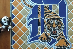 Swoop and a tiled mosaic Detroit Tigers logo.